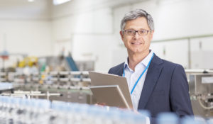 Supervisor smiling in bottling plant